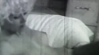 Sexy does a hand stand without a top on