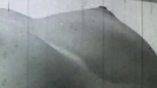 Sexy does a hand stand without a top on