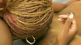 Black gets bent over and women fucks her with strap-on penis from behind