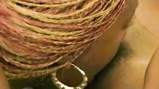 Black gets bent over and women fucks her with strap-on penis from behind