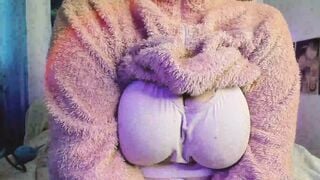 a fat woman inside a fluffy suit shows her body