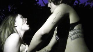 lesbians have fun outdoors inside night