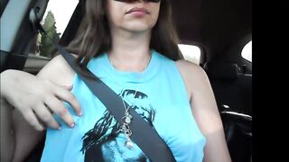 Miss Eva having fun with her boobies and nipples into the vehicle