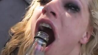 Blonde whore bends over to suck a penis and at the same time to got it