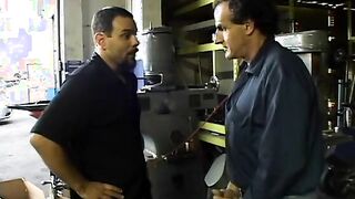 2 service technicians drill stunning dark hair inside the garage
