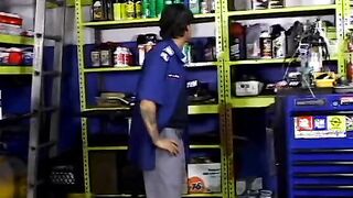 2 service technicians drill stunning dark hair inside the garage