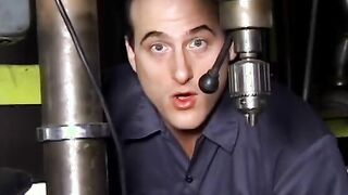 2 service technicians drill stunning dark hair inside the garage