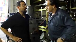 2 service technicians drill stunning dark hair inside the garage