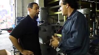 2 service technicians drill stunning dark hair inside the garage