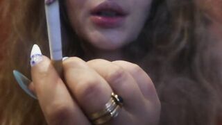 SMOKE BDSM CHICK into shorts SMOKE a CIGARRET showing FINGER NAILS and FILTER CLOSEUP!