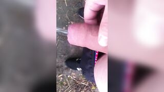 chav peeing and wanking into a field