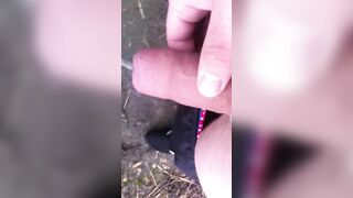chav peeing and wanking into a field