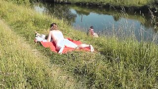 cougar hot Frina on river bank undressed and sunbathes nude. Random man fisherman watching for her, and into the end decided to join nude woman. Wild beach. Nudist beach. Outdoors nudity. Outdoor exposure. Nude into outside