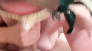 MsKinky slides on her mask to suck on a long penis.