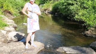 Anita Coxhard gets nude and masturbates by a tranquil stream
