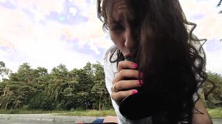 Kinky riding on the hood of a vehicle