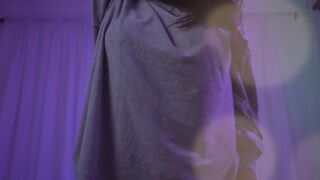 Natalie dancing and taking off her clothes
