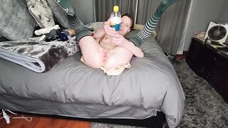 Stretching out my tiny snatch with thick objects that is shaped like a dick