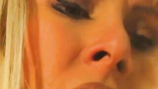 Big Boobed blonde lays on a desk and gets her cunt licked by babe blonde