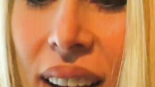 Big Boobed blonde lays on a desk and gets her cunt licked by babe blonde