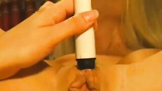 Big Boobed blonde lays on a desk and gets her cunt licked by babe blonde