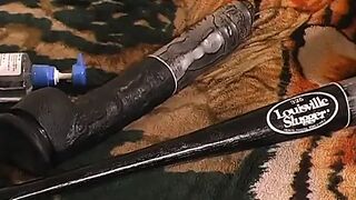 Dirty beauty shoves a big wooden pole inside her fuckhole