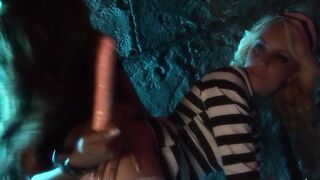 The lesbo jail guard has fun with her blonde prisoner as she brings her sex toys to