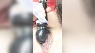 Rubs the clit with a dildo until orgasm