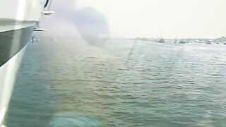 A dark haired lifeguard satisfies her vagina while working