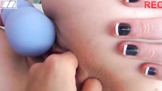 A spectacular ginger is filming her lesbo friend having fun with a toy and anal fingers