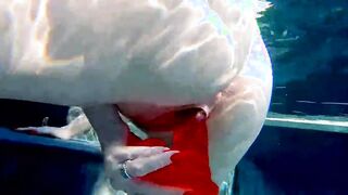 Red XXX fucks her vagina with a vibrator inside the pool