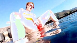 Red XXX fucks her vagina with a vibrator inside the pool
