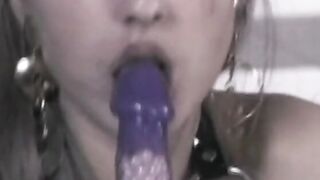 Vulgar dark haired sex fiend uses a leather whip on her round booty