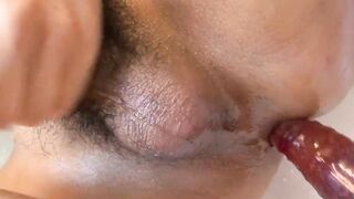 Vulgar cross dressing pleases herself into the hot tub with Sex Toy