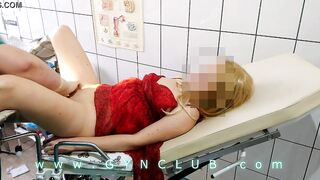 Woman inside red dress on gyno exam