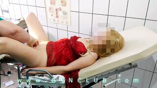 Woman inside red dress on gyno exam