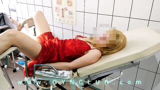Woman inside red dress on gyno exam