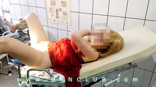 Woman inside red dress on gyno exam