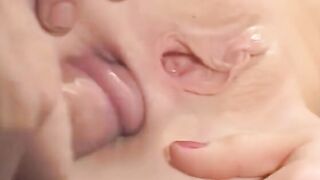 Red fellatio whore takes penis up her cunt while giving oral sex