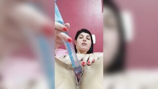 dark haired punching sex toy into cunt