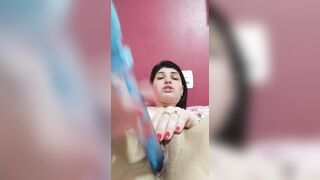 dark haired punching sex toy into cunt
