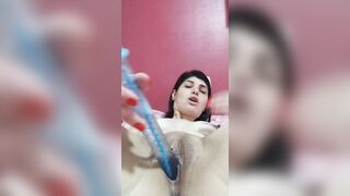 dark haired punching sex toy into cunt