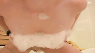 Meaghan masturbates inside the bath tub