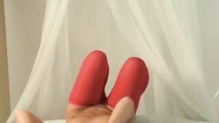 Exotic oriental gets naked and poses seductively into her red tights