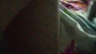 Jasmine is lying on the bed to the music and showing her charms (without sound)