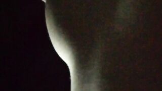 Jasmine is lying on the bed to the music and showing her charms (without sound)