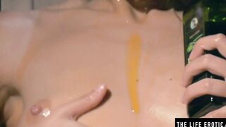 Using oil for lube as she puts her finger inside her tight holes