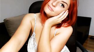 Chubby redhead teen rubbing her pussy on cam