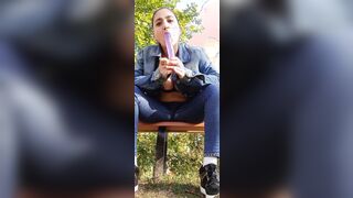 Amazingly Hot sluts blows her sex toy and fucks her snatch on the bench at the outdoors garden