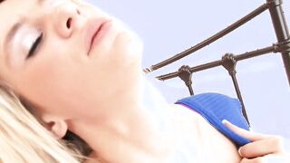 Blue eyed whore touching her hooters for satisfaction